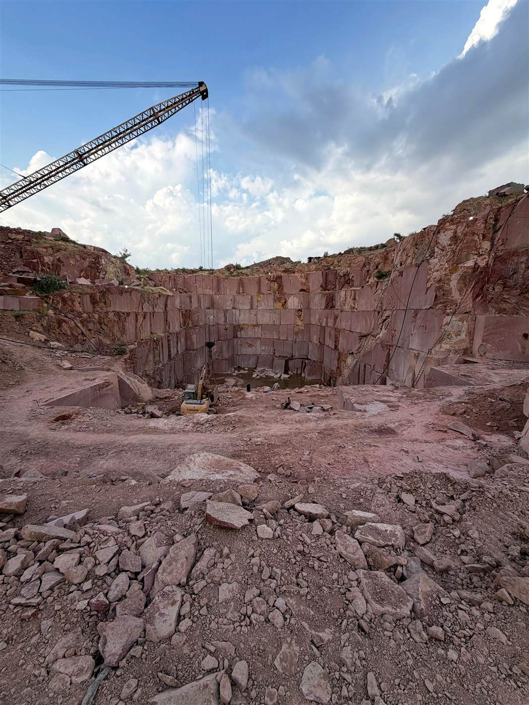 Terraced quarry face at RJ Minerals' Lakha Red Granite mine